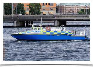 Water police shadowing the parade.